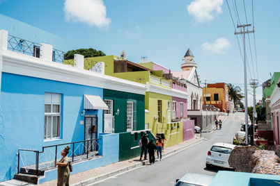 • The streets of the Bo-Kaap neighborhood in Cape Town are lined with colorful houses.
• The Bo-Kaap neighborhood boasts brightly painted homes, set against the backdrop of Table Mountain.
• The image features a cobblestone street and historic houses located in the Bo-Kaap neighborhood of Cape Town.
• A family strolls through the vibrant Bo-Kaap neighborhood.
• Traditional Cape Malay homes in Bo-Kaap, Cape Town.
• Close-up of vibrant house colors in the Bo-Kaap district.
• Street view showcasing Bo-Kaap’s cultural architecture.
• The Bo-Kaap neighborhood reflects Cape Town’s rich cultural history.