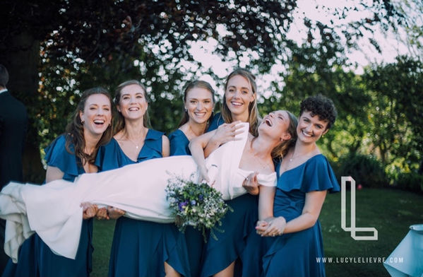 bride bridesmaids in arms.jpeg