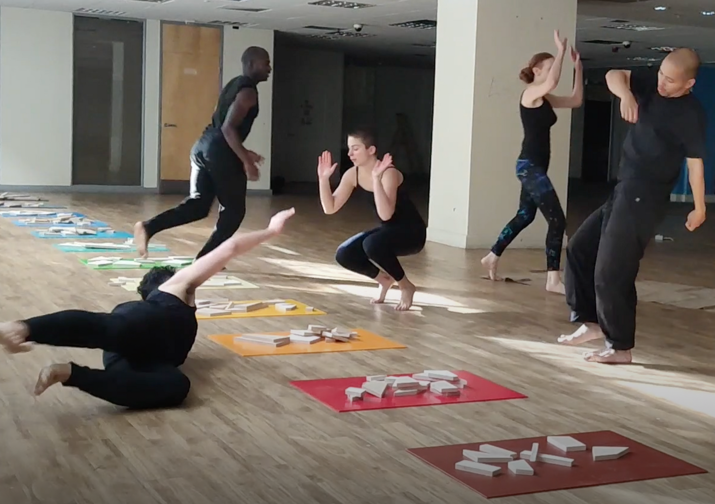"Random Chromatics Performance" with Alice Anderson, Jon Caruana, Valerie Ebuwa, Eline Peres, James Olivo gathering scrap wood into a dance where shapes and colours randomly meet, 2022.