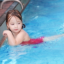 Girl Swimming in Pool