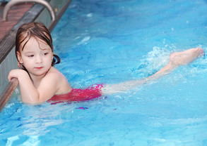 Girl Swimming in Pool