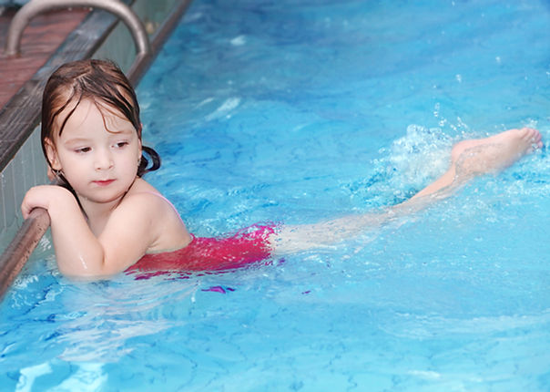 Girl Swimming in Pool