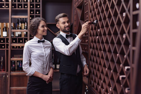 two-young-professional-sommeliers-choosing-wine-in-2021-09-03-01-45-43-utc.jpg