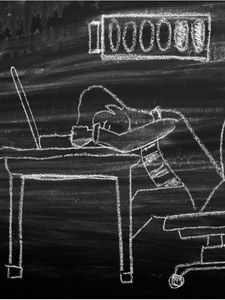 Dessin à la craie sur tableau noir montrant une personne effondrée à son bureau, illustrant les signaux du burnout avant l'effondrement