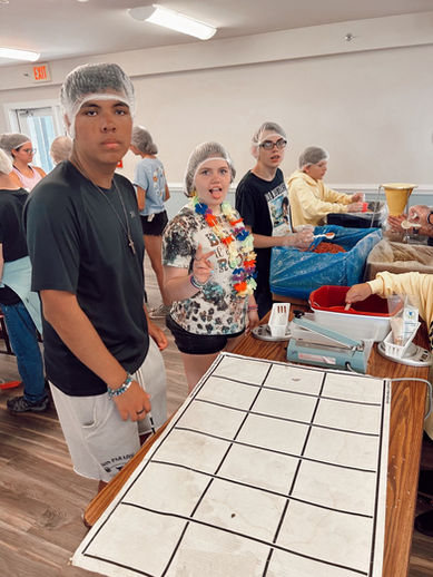 Volunteers preparing food; event checklist