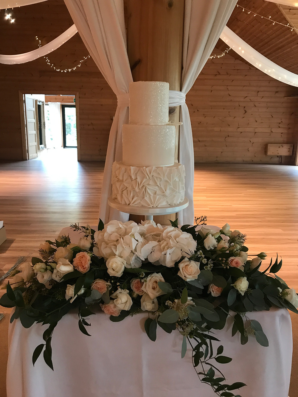 Modern white wedding cake at Styal Lodge, Cheshire