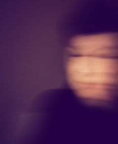 A blurry warped portrait signifying disconnection from self