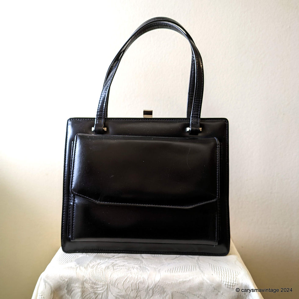 Black top handle handbag with front pocket