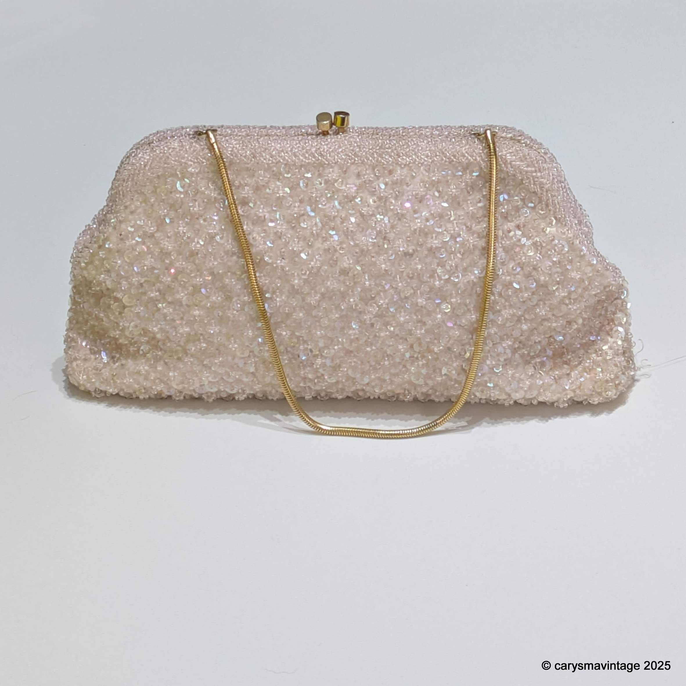 Le Soir pale pink sequinned evening bag