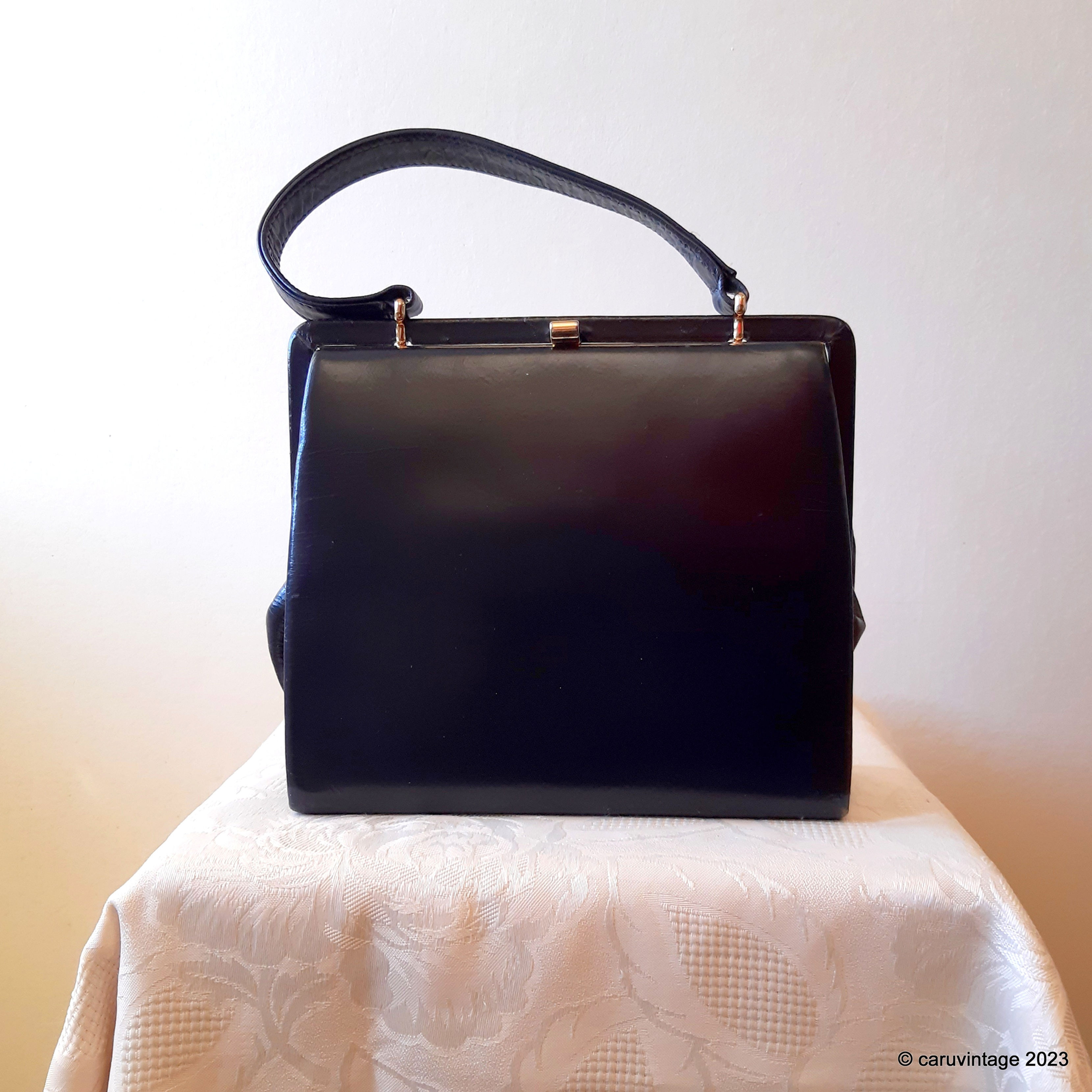 Eros navy blue small single handled handbag