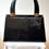 Thumbnail: Jane Shilton black patent leather handbag with single rigid handle