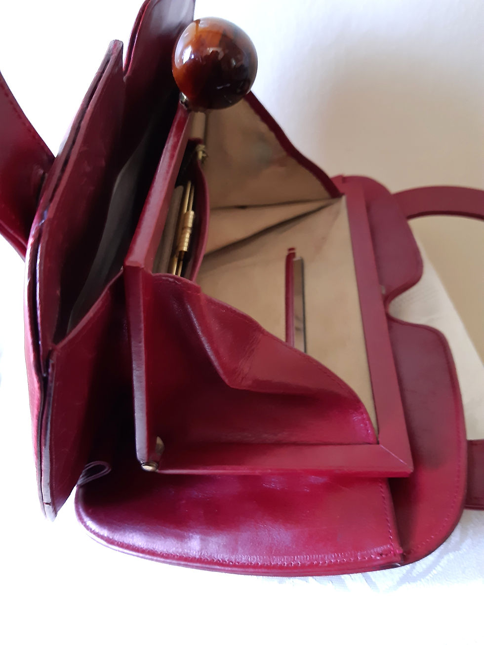 Thumbnail: 1940s/50s deep red leather handbag with amber effect ball clasp