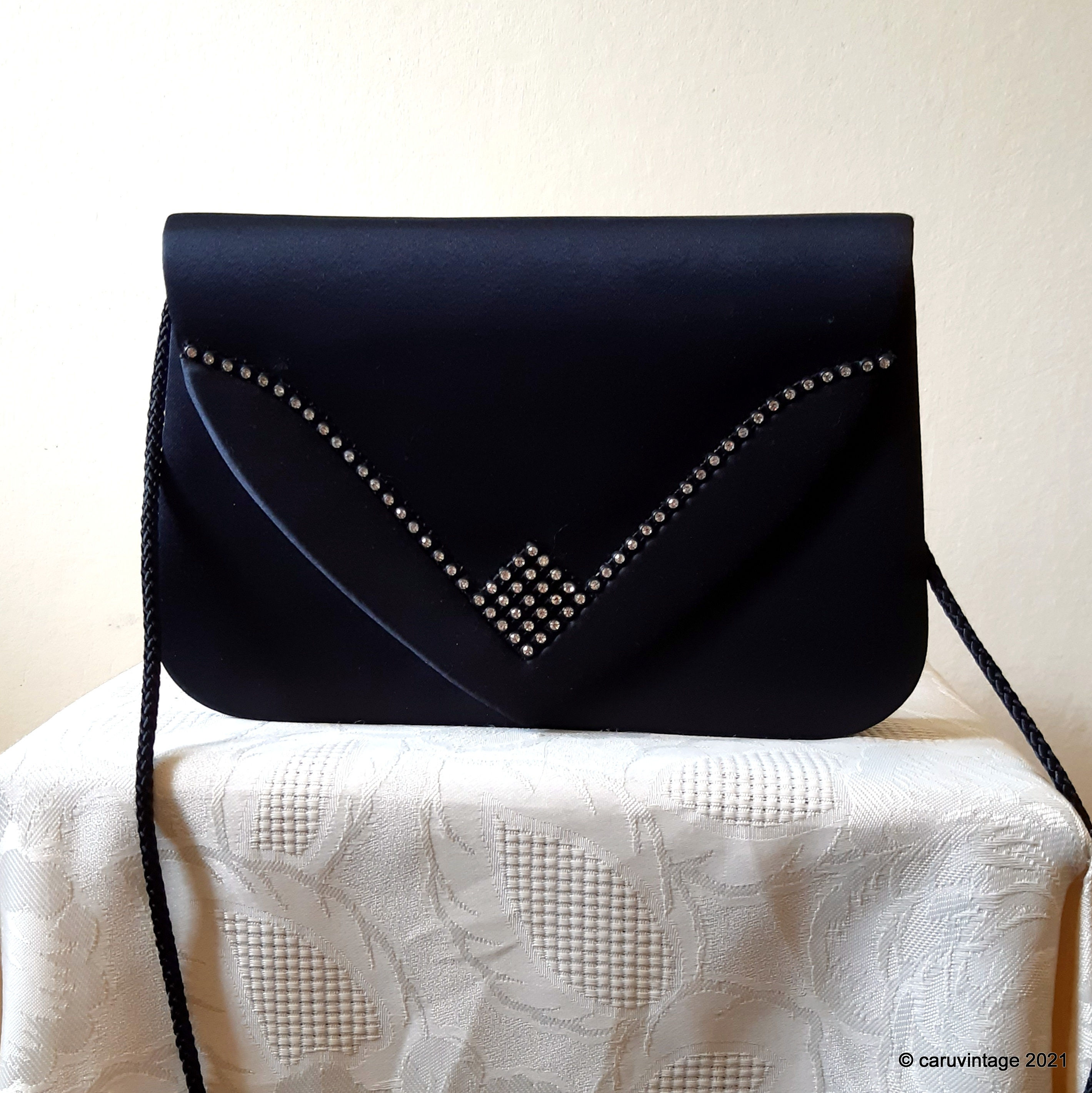 Black satin evening bag with sparkly diamante detail