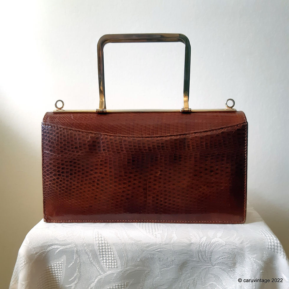 Tan brown glossy reptile effect clutch bag with metal handles