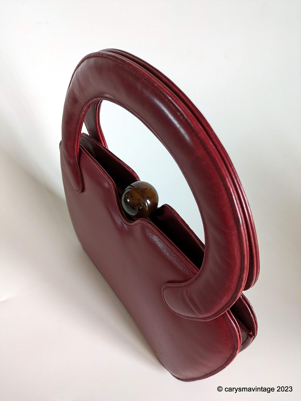 Thumbnail: 1940s/50s deep red leather handbag with amber effect ball clasp