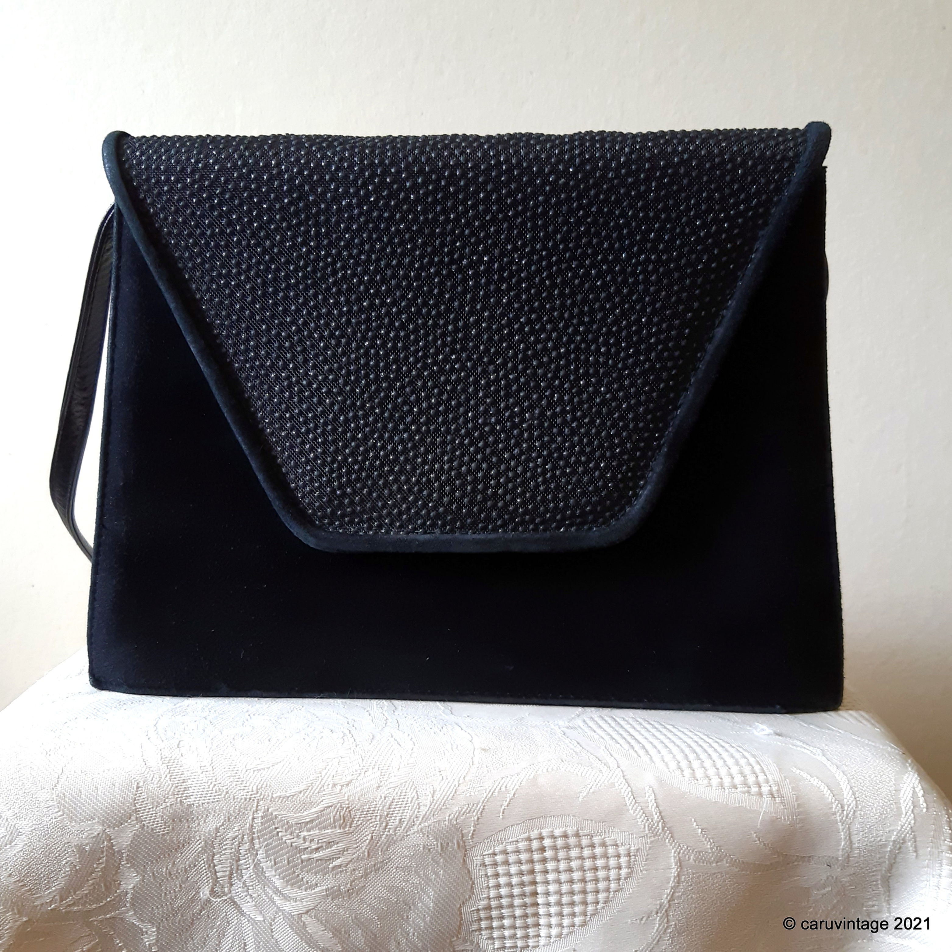 Black suede and leather shoulder bag with textured flap