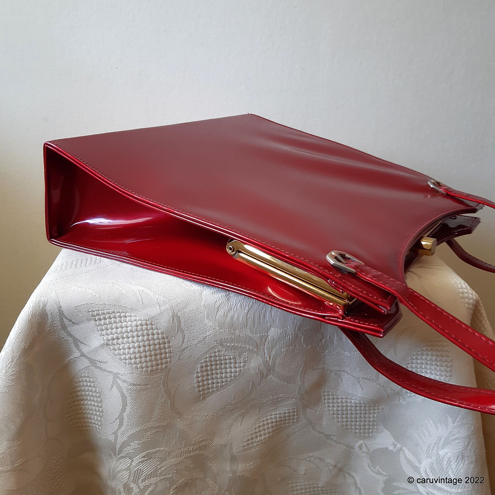 Thumbnail: Debonair red glossy patent handbag