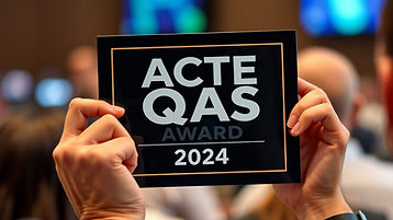 people holding award up to camera that says ACTE QAS Award 2024 with no other words in pic