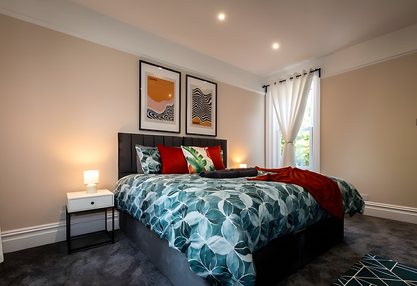 Modern bedroom with leafy duvet at WJO Stays locations