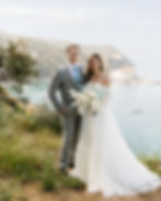 bride and groom pose on a mountaintop in Catalina island