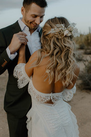 bridal hair piece and lacy wedding dress
