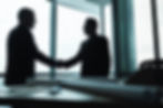manager-shaking-hands-of-business-partner-in-meeting