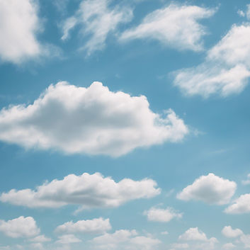 light colored wispy clouds in a light blue sky .jpg