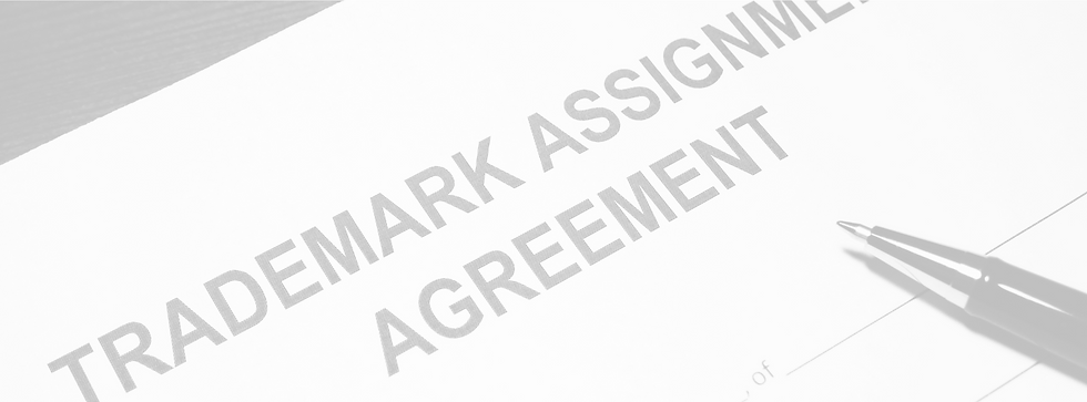 A black and white picture of a trademark assignment agreement form.