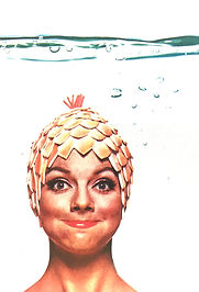 Woman holding her breath underwater.