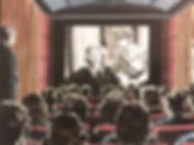 cinema audience watching a film movie.