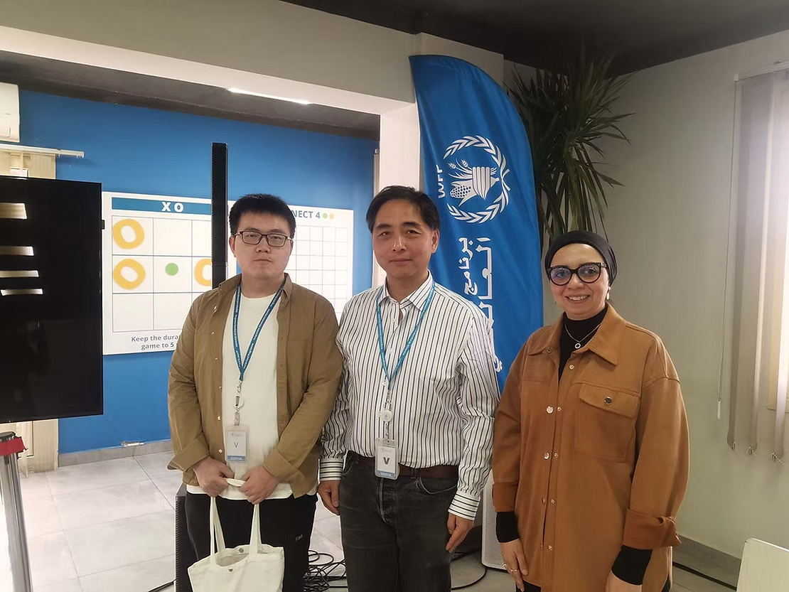 Photo: Mr. Lee Siu Hin (center), head of Panda Aid, Mr. Huang Shimin (left), a member of Panda Aid, and Ms. Dalia Amin of Logistics Cluster pose for a photo.