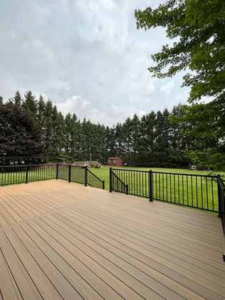 Composite deck in Timbertech Coconut Husk with Classic Regal Black aluminum railing