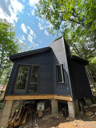 Modern cottage sided with Fraser wood siding