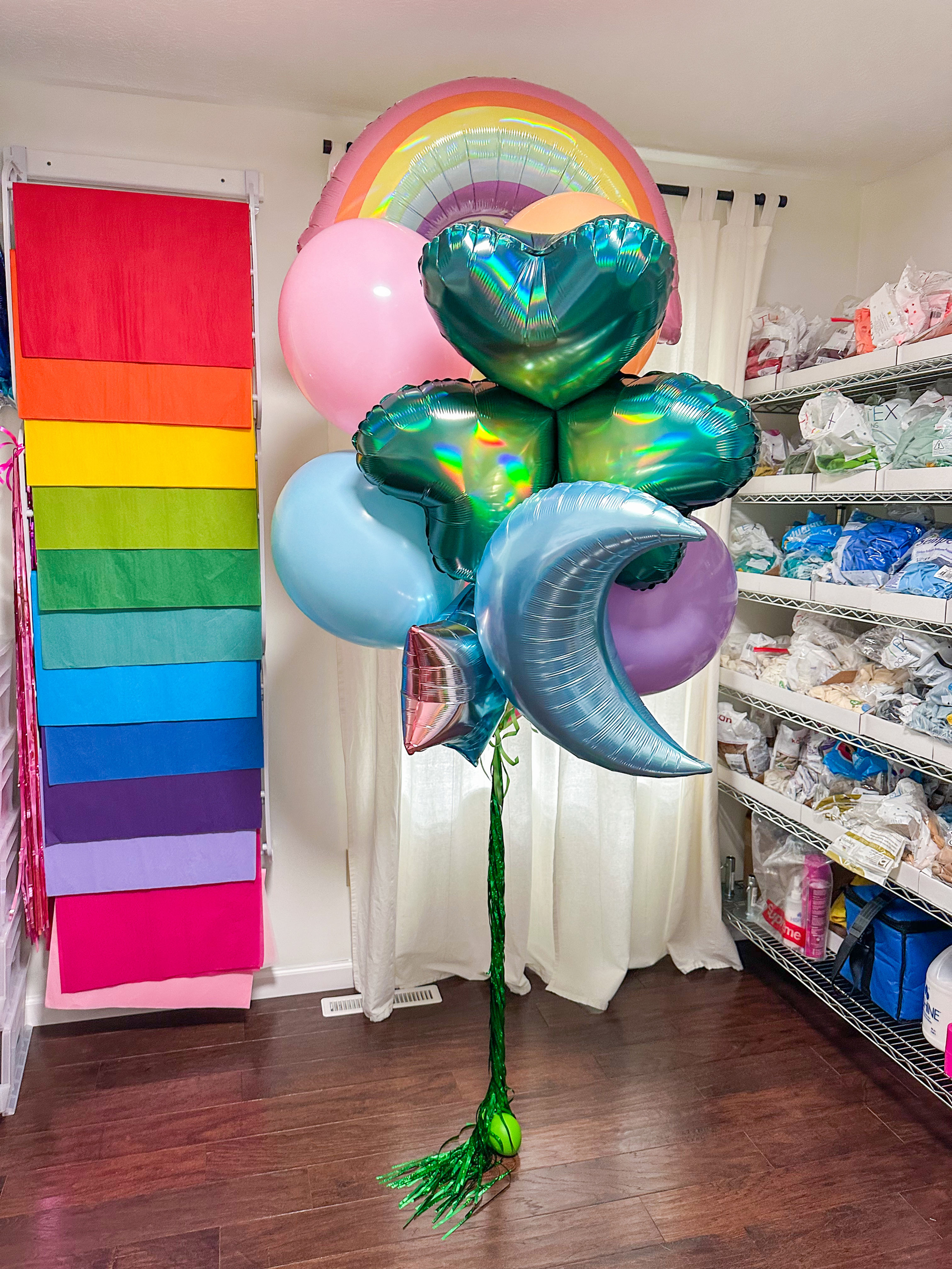Deluxe mixed helium balloon bouquet with rainbow, heart, and moon balloons.