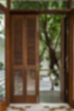louvred door from drawing room into north court