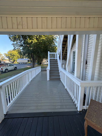 Renovated ramp and stairs to group home.  Brand new composite deck boards installed with fresh white paint.  