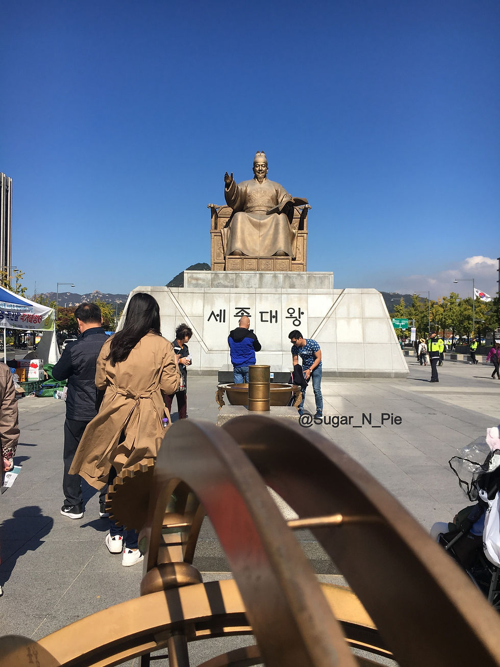 Statue of King Sejong the Great with main invention under his reign