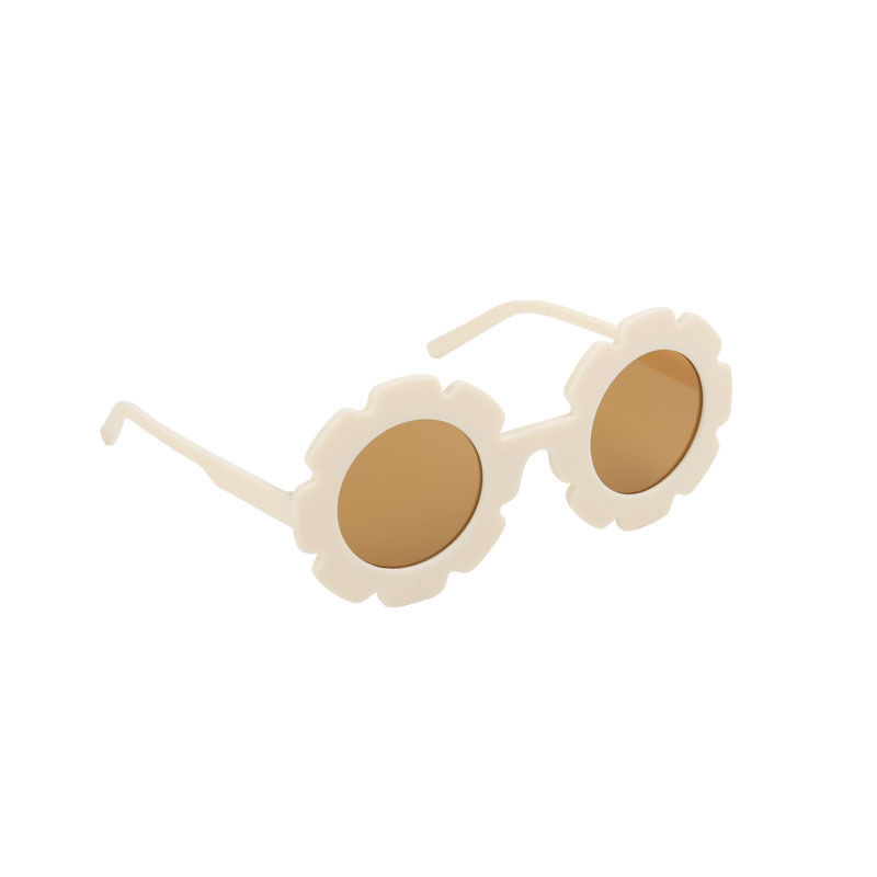 Thumbnail: White flower-shaped sunglasses with brown lenses isolated on white background