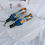 Thumbnail: Two colorful umbrellas on a white surface against NanaPouchKids background.