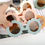 Thumbnail: Hand holding flower sunglasses, various colors. Children's style eye protection accessory.