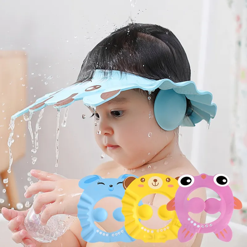 Baby wearing blue shower cap with colorful toys in bath, NanaPouchKids