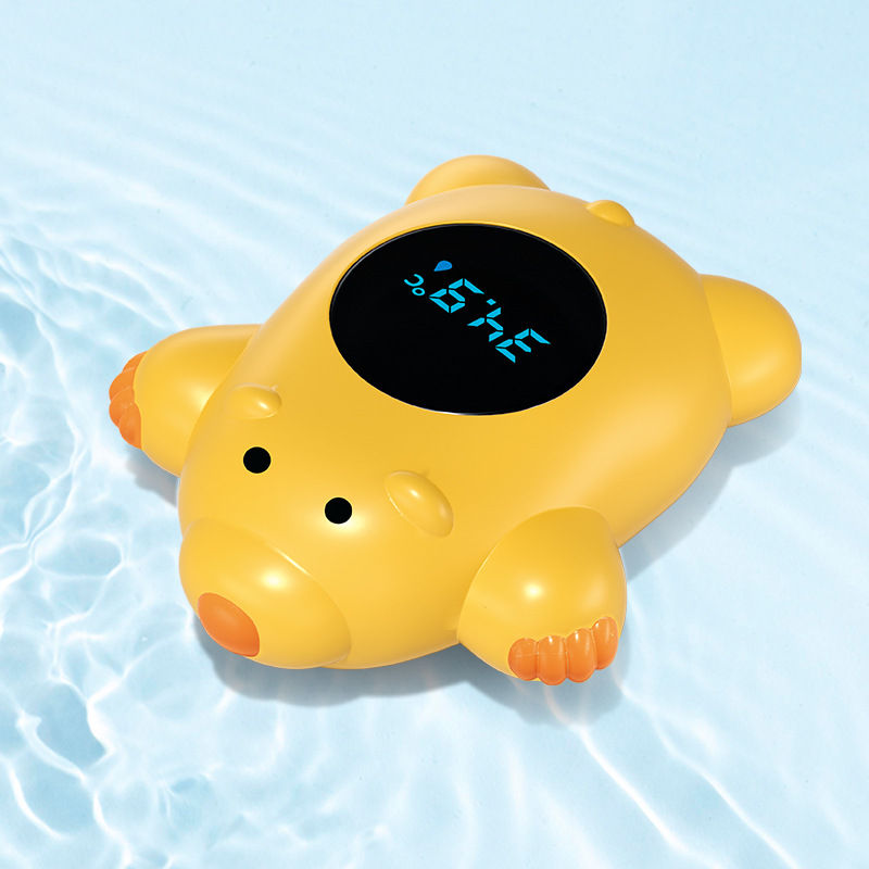 Thumbnail: Yellow bear-shaped bath water thermometer with display reading 34.9°C in water.