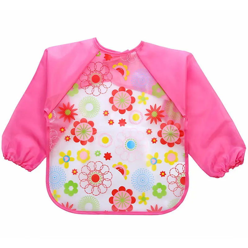 Thumbnail: Pink floral bib with long sleeves, NanaPouchKids, for messy meal times.
