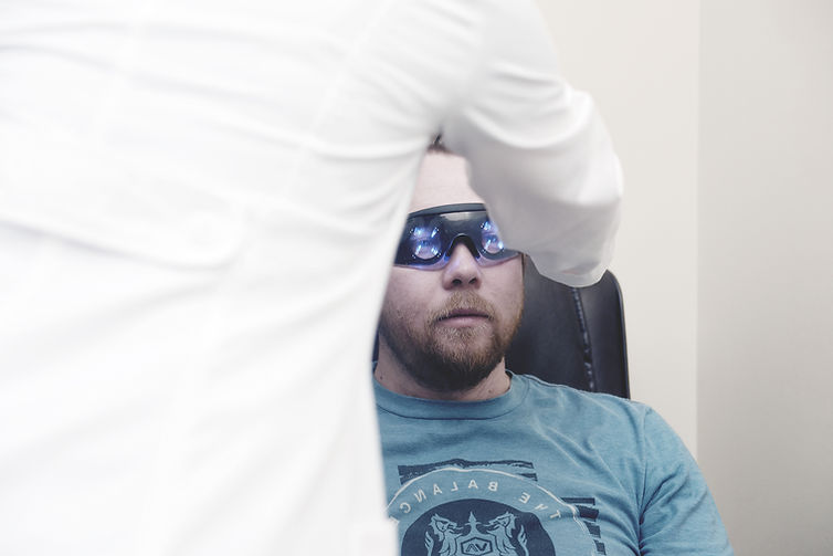 A patient wearing neurofeedback glasses.