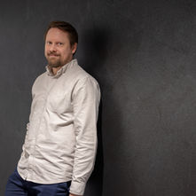 Founder against a dark wall