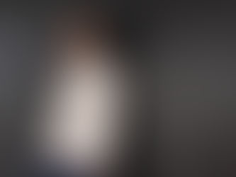 Founder against a dark wall