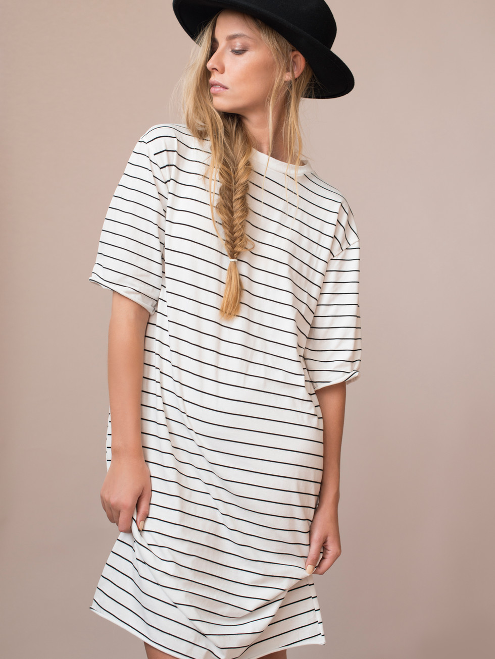 Woman wearing striped Tunic dress and a black hat, U&H eCommerce.