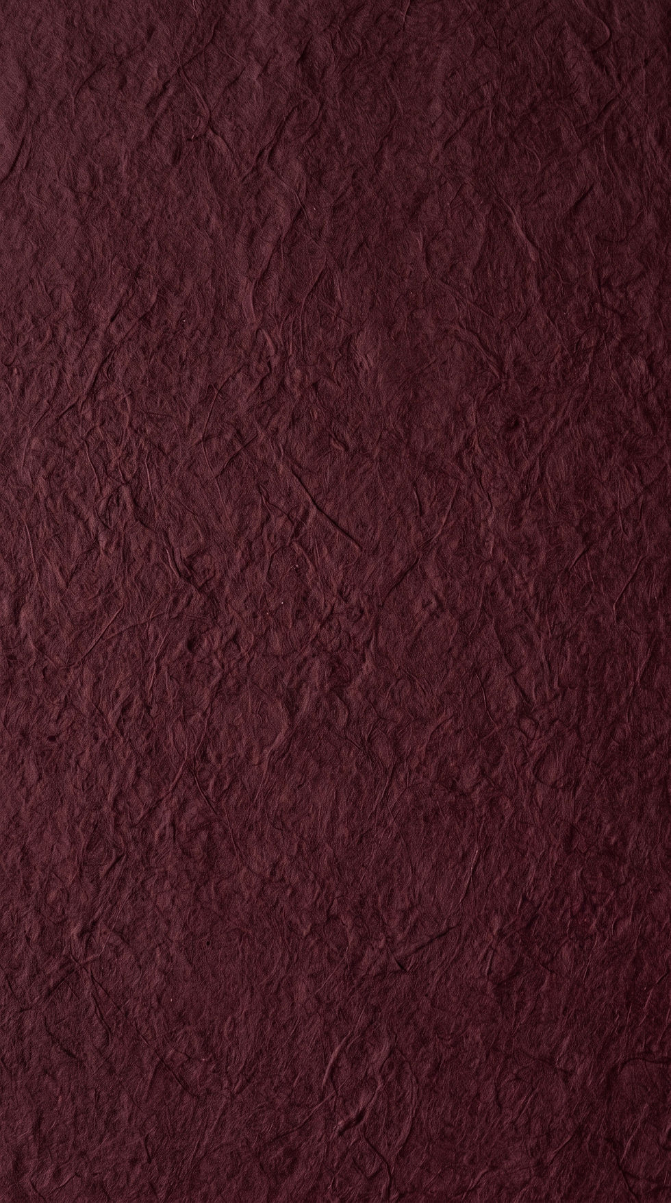 Maroon_textured_paper_surface_2K_202607100118.jpeg