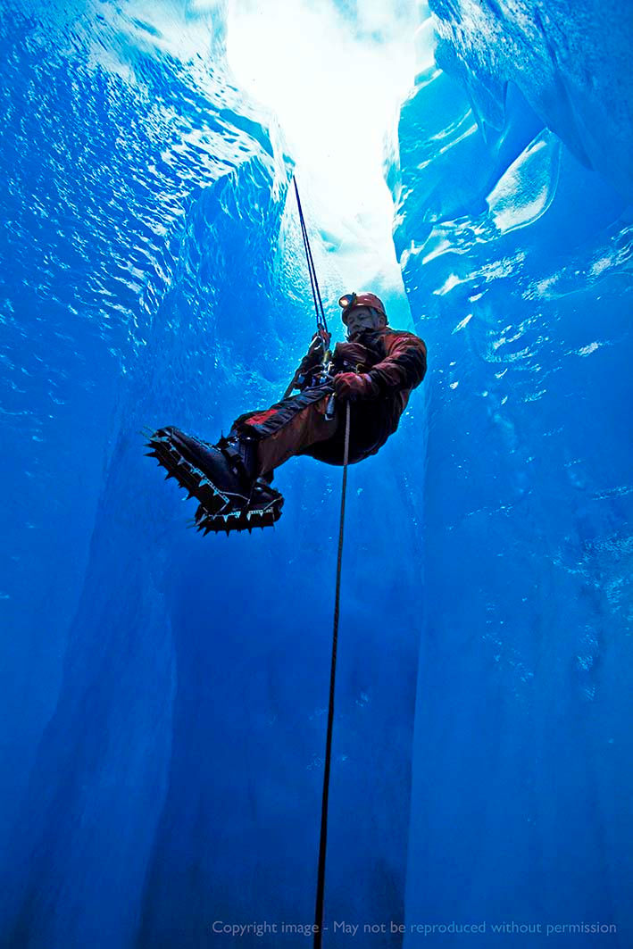 Abseiling into an ice cave