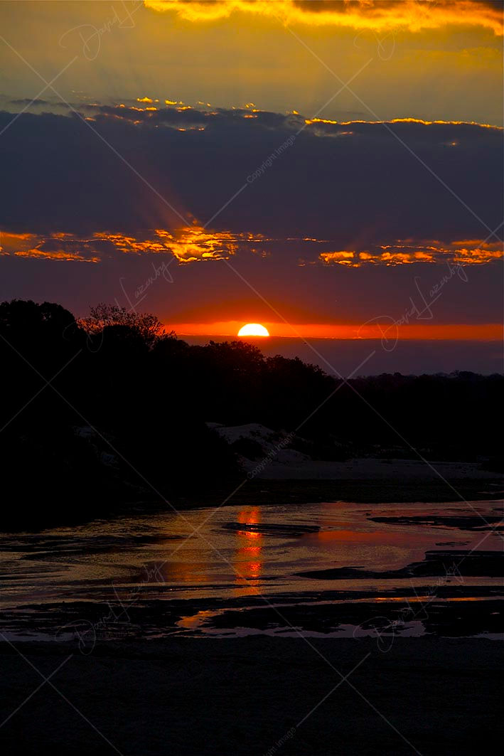 Sunset over Sand River,